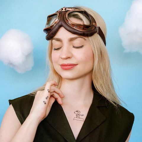 Many Faces of Snoopy Tattoo Tin